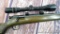 Savage Stevens Model 125 bolt action .22 rifle with 3-9x40 scope in see-through mounts. Wood is