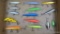 14 fishing lures include Rapala, Rebel, Red Eye Juniors, more. Longest is about 6