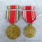 Two WWII metals with ribbon and bar pins. Red and white ribboned metal is marked 'Efficiency Honor