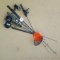 5 Ice fishing poles and 2 ice scoops. Includes Optimax 101 reel.