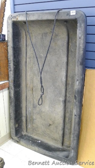 Plastic pull behind sled is 36" x 60" x 7" deep and has a crack and dent on back corner.