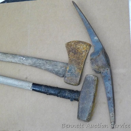 Single bit ax, pic ax head, and a sledge hammer. Sledge hammer head is 8" and handle is taped.