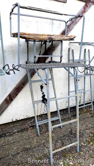 Nice double ladder tree stand has an approx 10' ladder. Measures about 42" wide and had padded seat