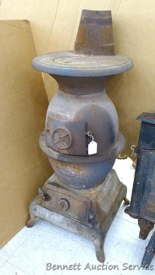 Vintage Cannon No. 35 cast iron round belly stove is 20" x 50" x 20 and has a crack in the top. Cute