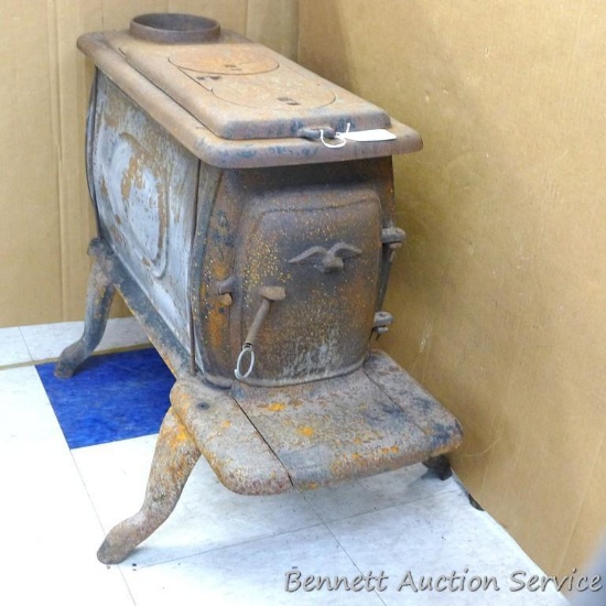 Vintage cast iron wood stove is 21" x 33" x 25" tall and would make a nice project piece.