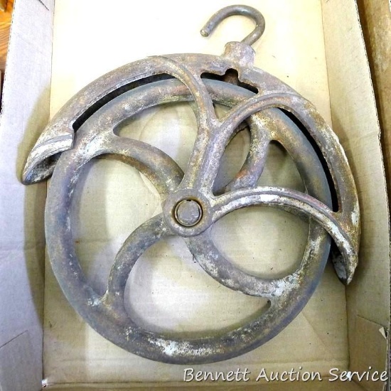 Cast iron hay pulley is about 13" x 12".