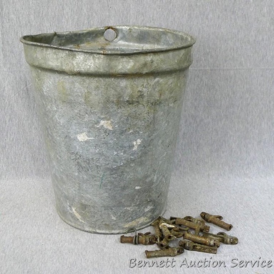 Vintage maple sap bucket includes 12 antique cast iron spiles. Bucket is approx 11" x 13" tall.
