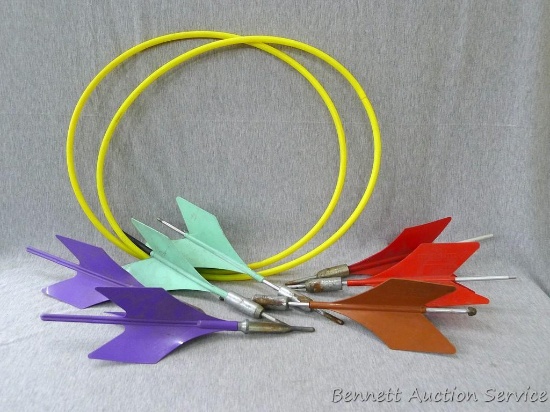 Seven lawn darts and two hoops. Darts look to be useable, and are about 14" long.