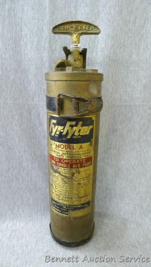 Brass Fry-Fyter Model A vintage fire extinguisher with mounting bracket. Measures approx 14" long.