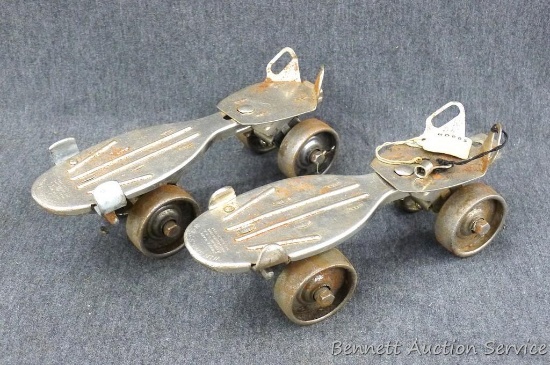 Winchester clamp on roller skates with key. Skates are 9" x 3", all wheels turn nicely. Key fits one
