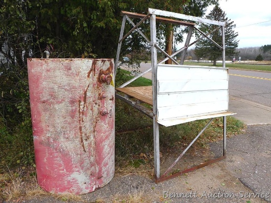 Fuel barrel on a metal stand; barrel is about 40" x 60". Metal stand is about 56" x 52" x 85" tall.