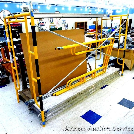 Two sets of Biljax Haulotte scaffolding set up to be about 77" x 43" x 10'.