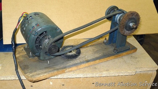 Homemade bench grinder and wire wheel buffer is mounted on a 21" x 10" board and is about 10" tall.