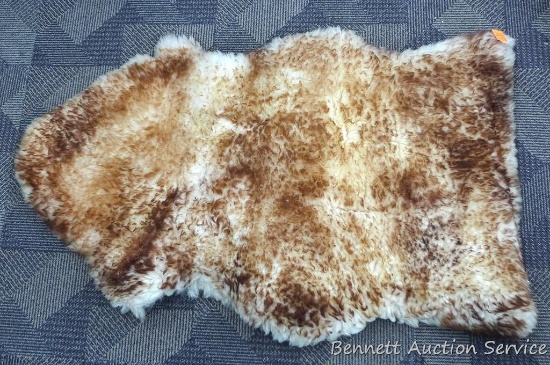 Nuknuuk genuine natural sheepskin rug is 24" x 40" and appears nice.