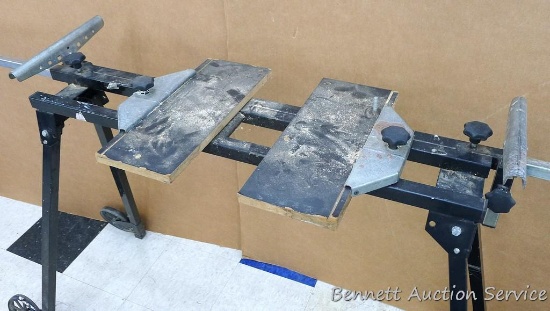 Folding Wolfcraft chop saw stand extends out to 10'. Body stands approx 40" x 16" x 36". Has wheels