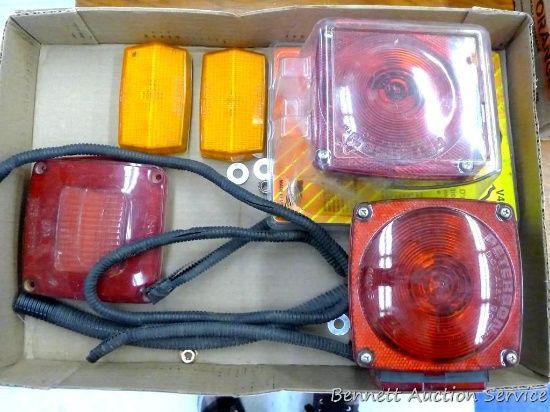 Two stop and turn taillights ( one is NIP), side marker lights, taillight lenses, more.