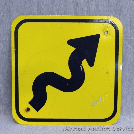 Curved trail sign is 12" x 12" and has some scratches and cracks in the reflective paint.
