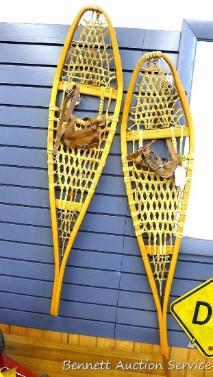 Wooden snow shoes are 10" x 45" with leather bindings. All appear in good shape.