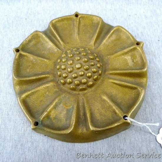 Cast brass flower measures 8" in diameter.