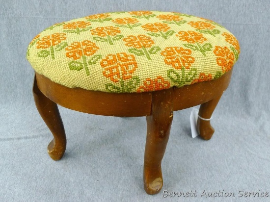Adorable little foot stool with a needle point cushion; measures 15" x 11-1/2" x 10-1/2" tall.
