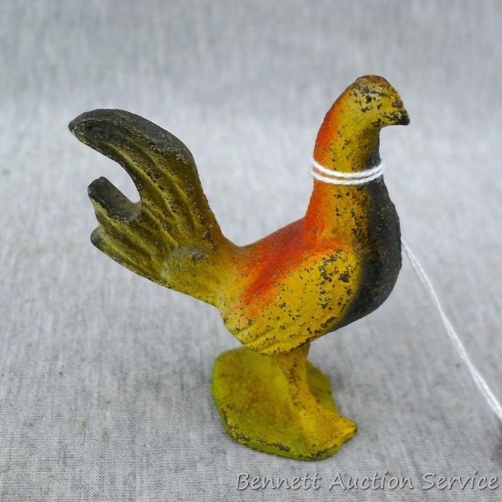 Cute little cast iron rooster measures 1-1/4" x 1-3/4" x 3" tall. Old chip on base.