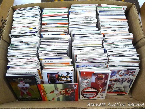 Collection of unsorted football cards.
