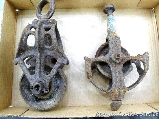 Two cast iron barn hay mow pulleys, each approx. 10".
