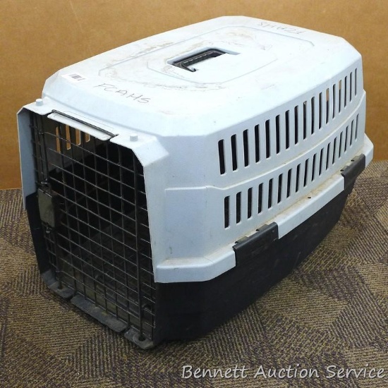 American Kennel Club pet carrier is about 26" x 17" x 17" high and comes with and extra door. Top