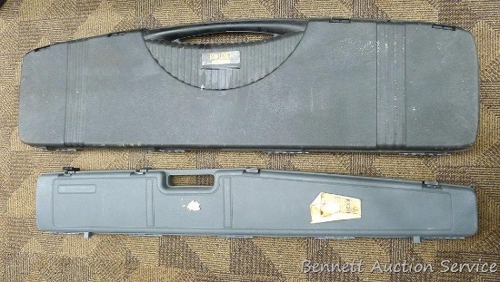 Two Kolpin and Roughrider hard gun cases. Kolpin case looks to be in good condition but could use a