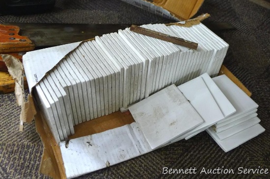 Partial box of white tiles measuring 4-1/4" x 4-1/4".