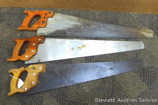 Three carpenter saws including rip and cross cut saws. Measure approx 31" long.