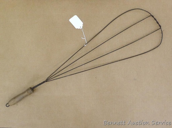 Vintage rug beater is about 31" x 9".