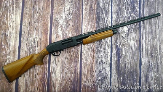 Escort M87 pump action 12 gauge shotgun is as-new with original box. 28" barrel has a brilliant