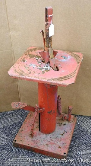 Metal tire changer is missing some parts, measures about 15" x 15" x 39".