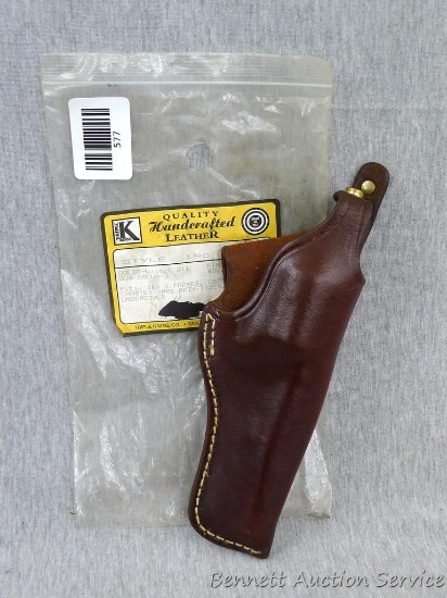 Triple K Brand handcrafted leather pistol holster is style 196 and about 8" x 3" wide. Fits S&W J