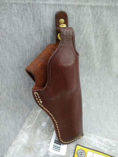 Triple K Brand handcrafted leather pistol holster is style 196 and about 8" x 3" wide. Fits S&W J