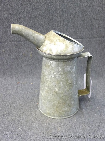 Galvanized one quart service station oil can is 9" tall and is in very nice condition.