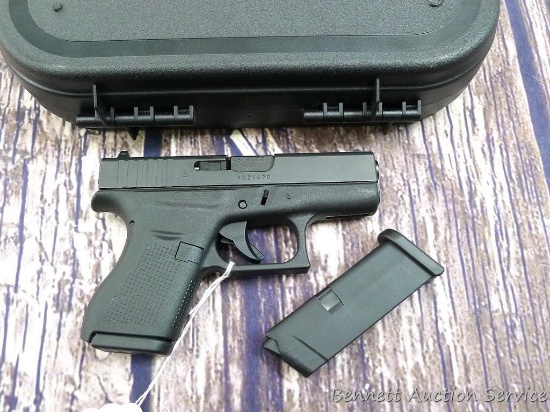 Glock Model 42 pistol in .380 looks to be near new and comes with two magazines, case, lock, more.