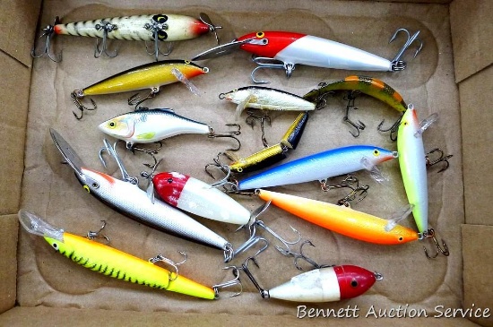 Collection of fishing lures include Rapala Finland, Rebel Fastrac, Rattl'n Rap, more. Largest is