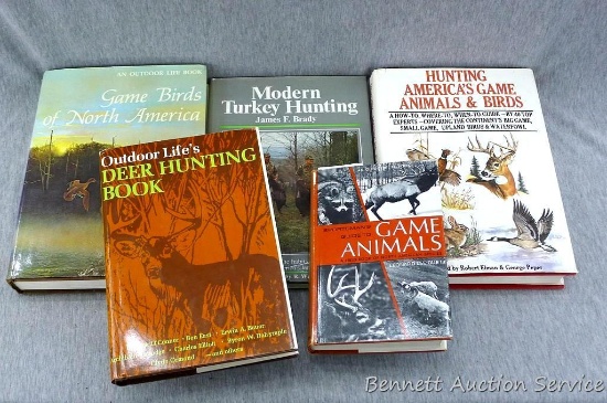 Several hunting books including Game Animals, Outdoor Life's Deer Hunting, Modern Turkey Hunting,