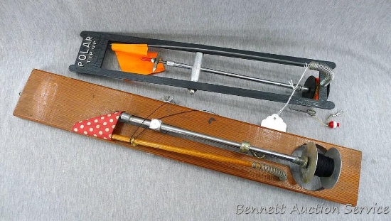 Polar and other wooden ice fishing tip-ups, largest is about 23" long.