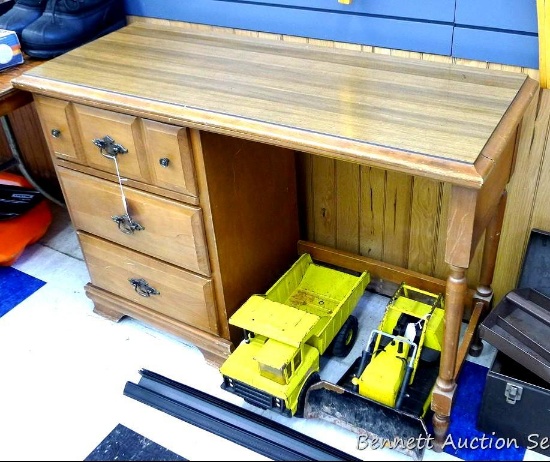3 Drawer wooden desk is 44" x 20" x 31" tall, feels sturdy with some scratches and dings. One drawer