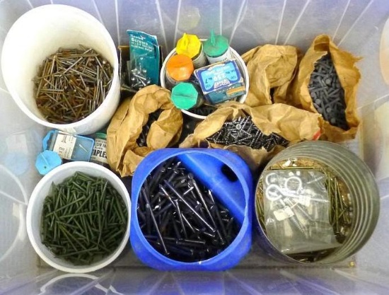 15 gallon tote containing nails, screws, eye bolts, more. Longest nail is 4".
