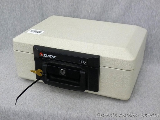 Sentry 1100 fire proof money safe; measures 14" x 10" x 6", looks new and comes with 1 key.