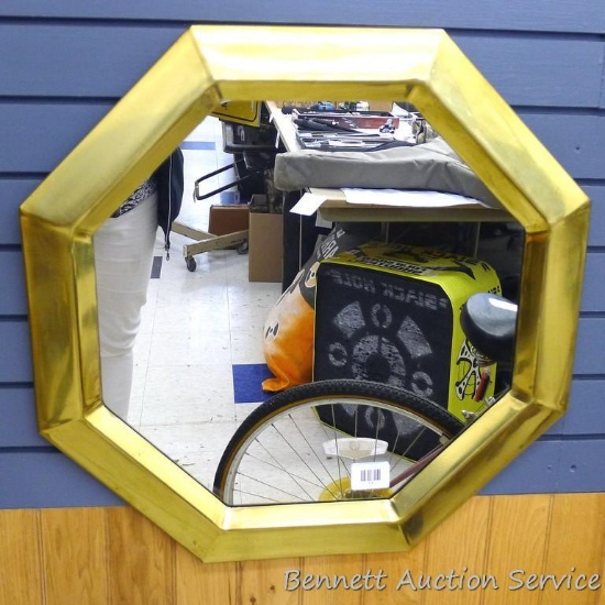 Octagon mirror with brass frame is 24" x 24".