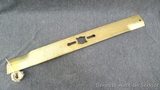 22" Universal lawn mower blade with 7 shaft adapters. Never used.