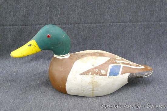 Wooden Evans Mallard decoy has glass eyes. Head is removeable. Measures approx 15" from beak to
