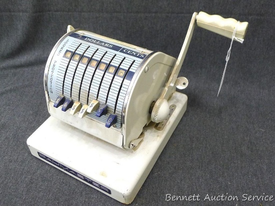 Paymaster series X-900 checkwriter is about 7-1/2" x 8-1/2" x 7" tall. Some levers do not move as
