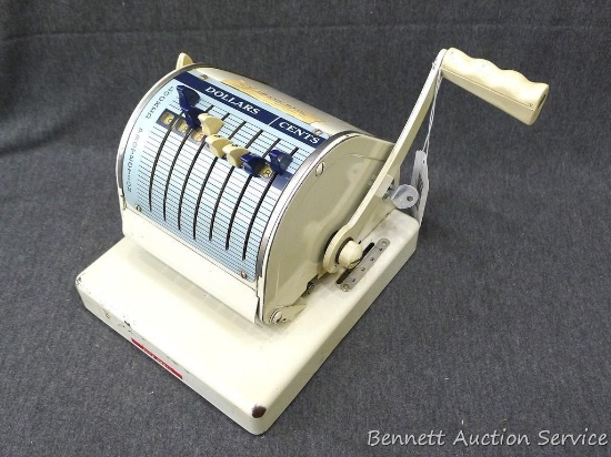 Paymaster series S-550 checkwriter is about 7-1/2" x 8-1/2" x 7" tall without handle. Front lavers