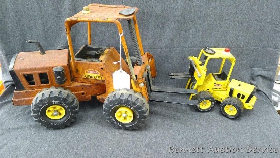 Two Tonka forklifts, larger is approx 15" x 12" x 9" without forks.